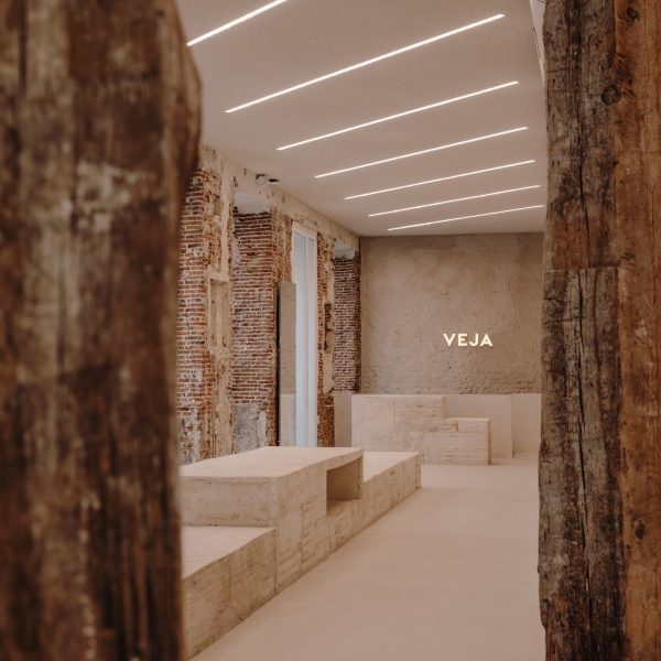 Concrete display plinths in shoe store by Plantea Estudio