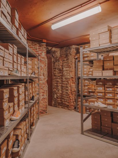 Storage shelves holding shoes in Veja store in Madrid