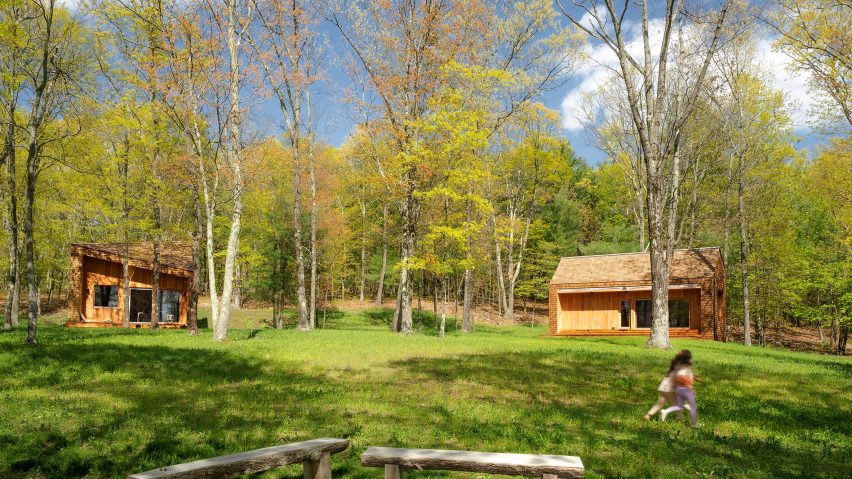 Two contemporary wooden cabins in the woods