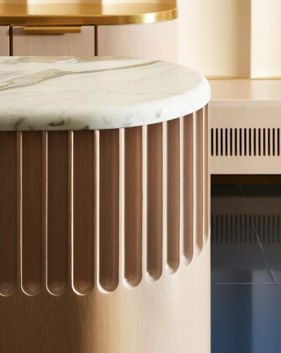 Marble-topped counter with rounded white oak front