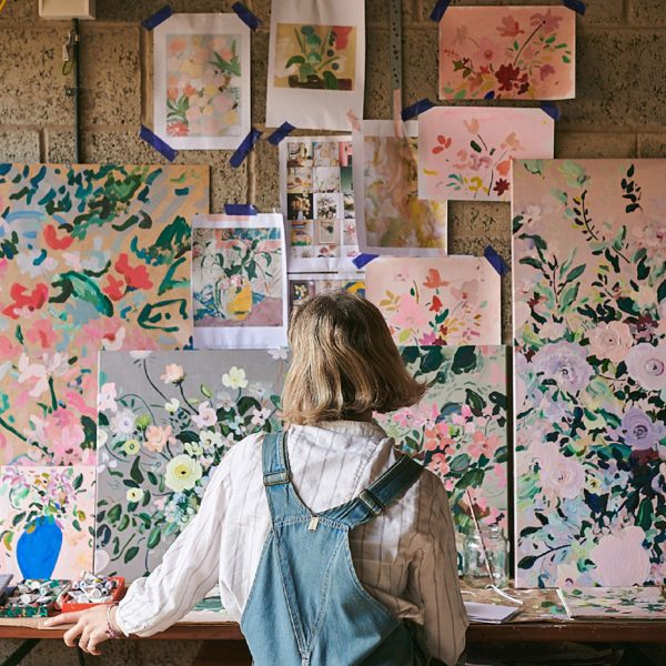 Photo of person looking at art on a wall