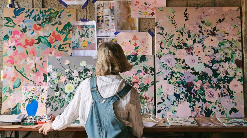 Photo of person looking at art on a wall