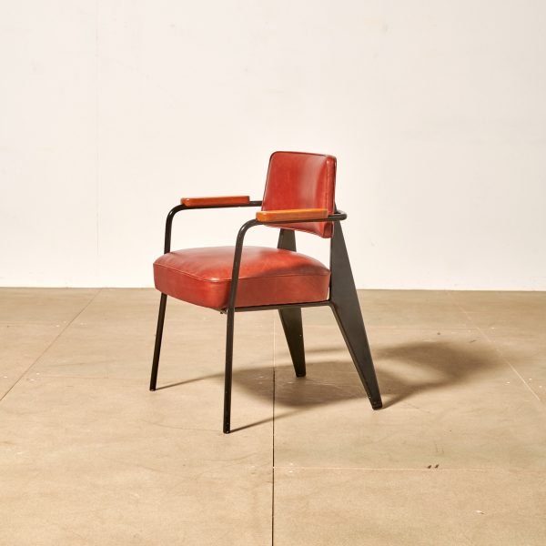 Photo of wood and red leather chair