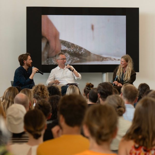 Photo of people talking at the Materials of Tomorrow symposium