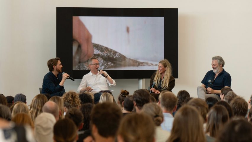 Photo of people talking at the Materials of Tomorrow symposium