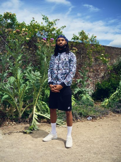 A model wearing the football kit with Yare pattern
