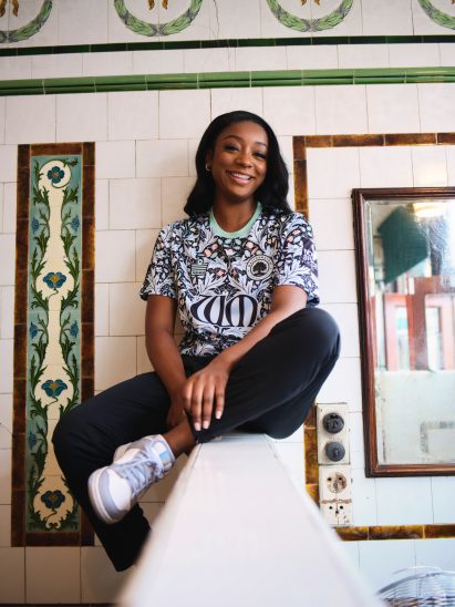 Model wearing football t-shirt with Morris & Co design named Yare
