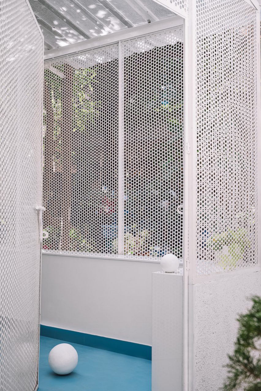 Perforated metal screen wall