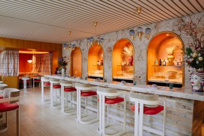 Stone bar counter with glowing arched niches behind