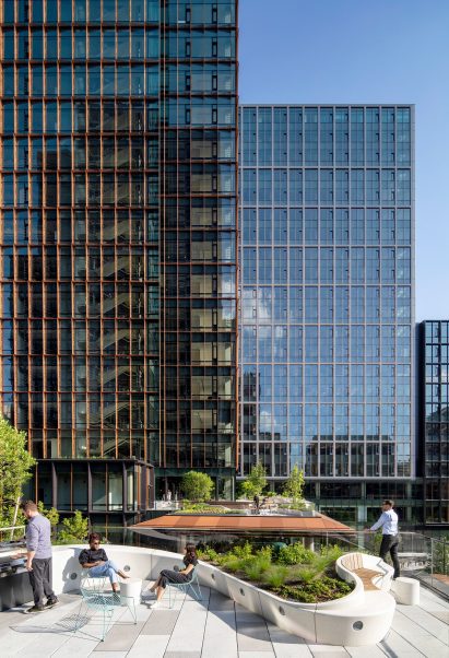 A bbq area in front of two large office buildings