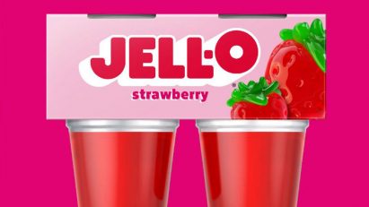 Strawberry jelly pots on a pink background