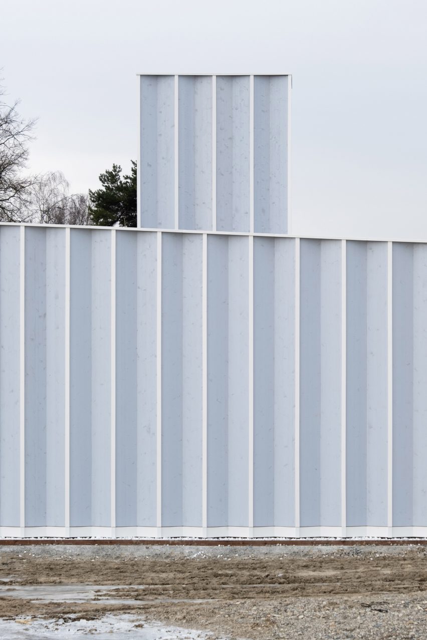 Pleated blue timber facade on a workshop by Cabinet