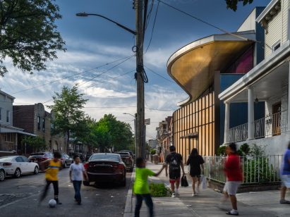 Swooping gold canopy on the Louis Armstrong Center in Queens