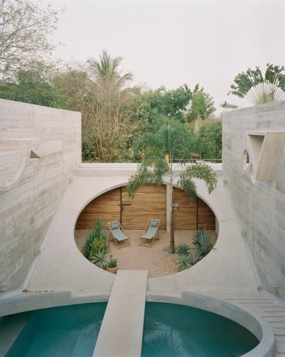 A home with two large circular cut outs in the roof