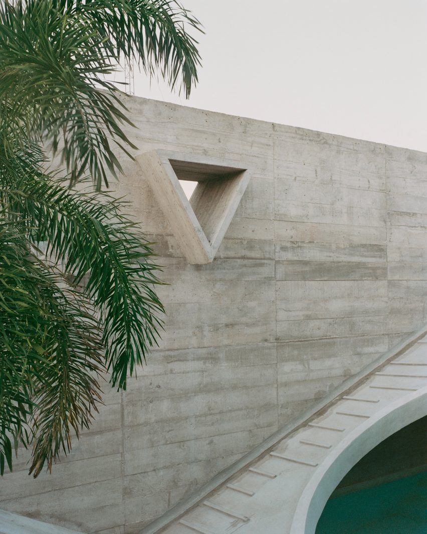 A triangular cut out in a concrete wall