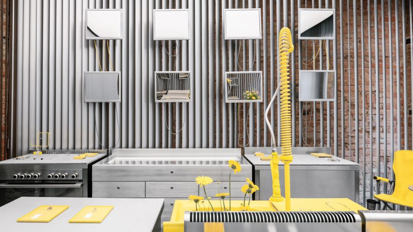 Store interior with stainless steel furniture and yellow sink