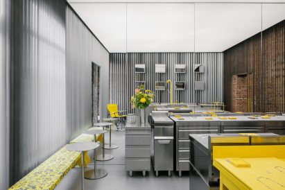 Store interior with stainless steel furniture and yellow sink