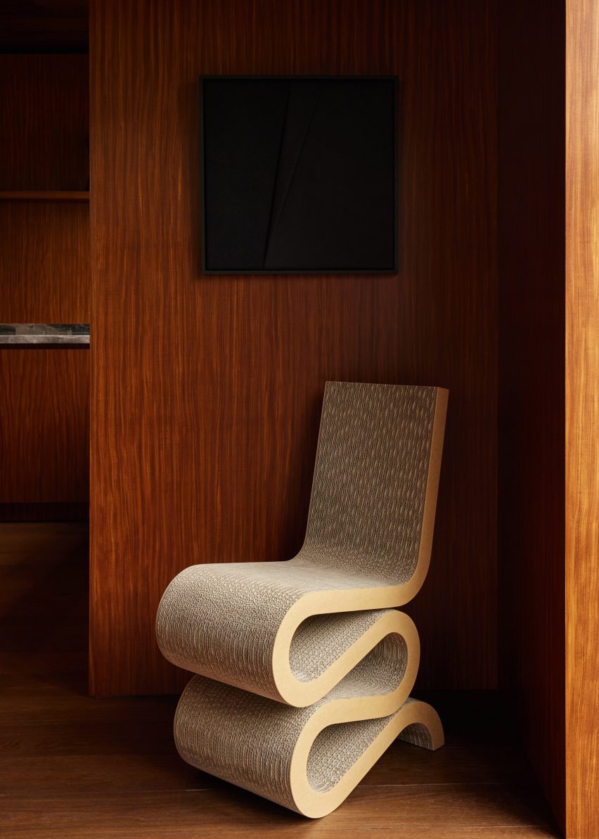 Wiggle Chair by Frank Gehry in a wood-lined interior