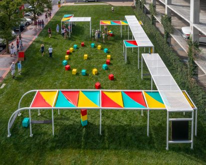 A long metal terrace with brightly coloured awnings