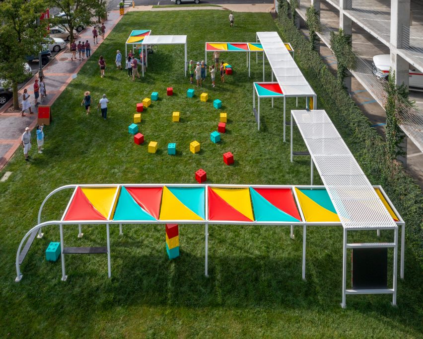 A long metal terrace with brightly coloured awnings