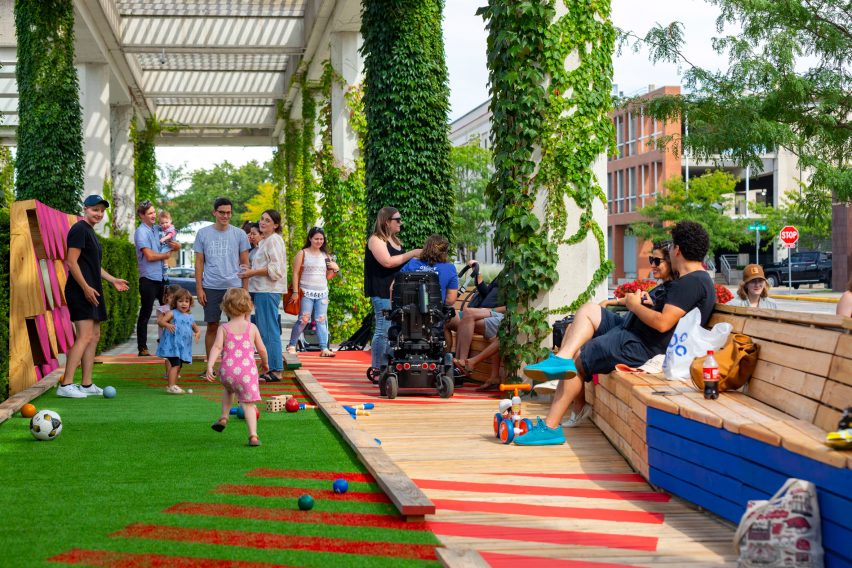 A colourful boardwalk installation with bright graphics