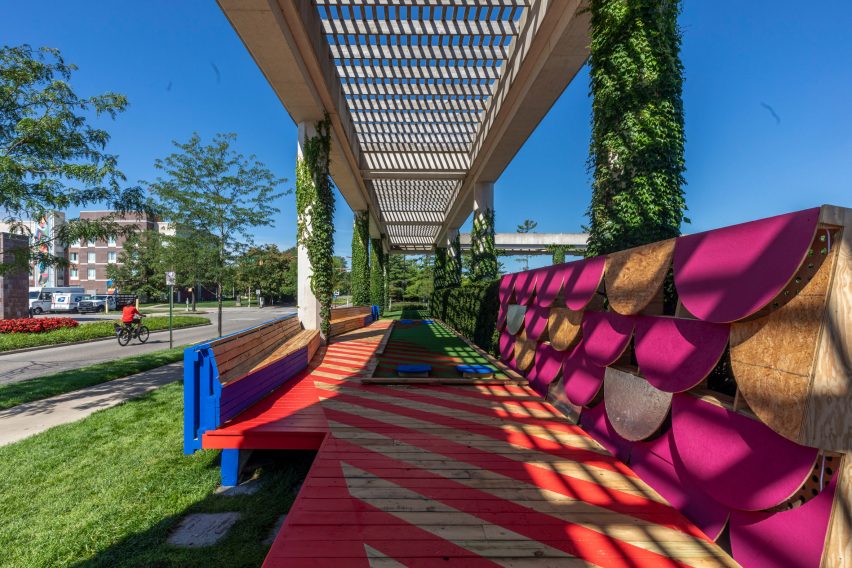 A colourful boardwalk installation with bright graphics