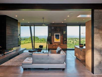 Couch and floor to ceiling windows