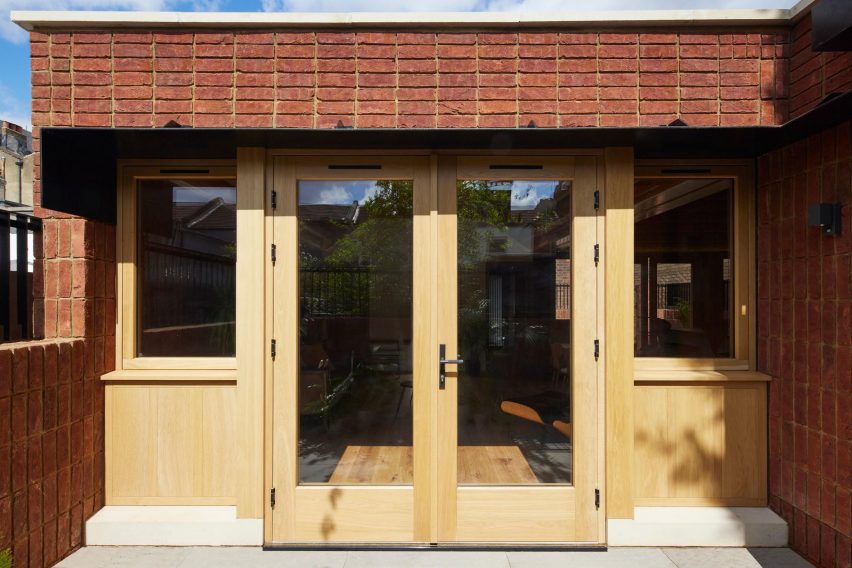 Close up of oak door and brickwork