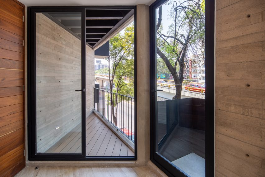 Interior space with glass doors leading to two balconies