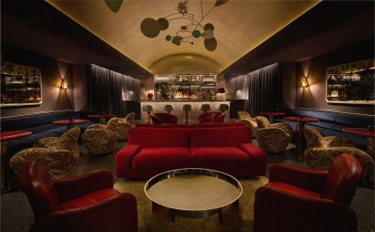 Dark bar lounge with a vaulted golden ceiling