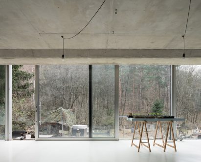Interior of concrete house in Pernek by Ksa Studený