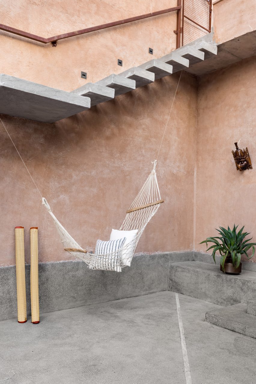Hammock hangs from cantilevered stairs at Hybrid House by Sketch Design Studio