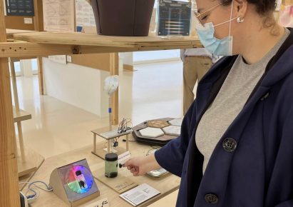 Person interacting with a notification desk display