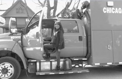 Person standing on a large vehicle
