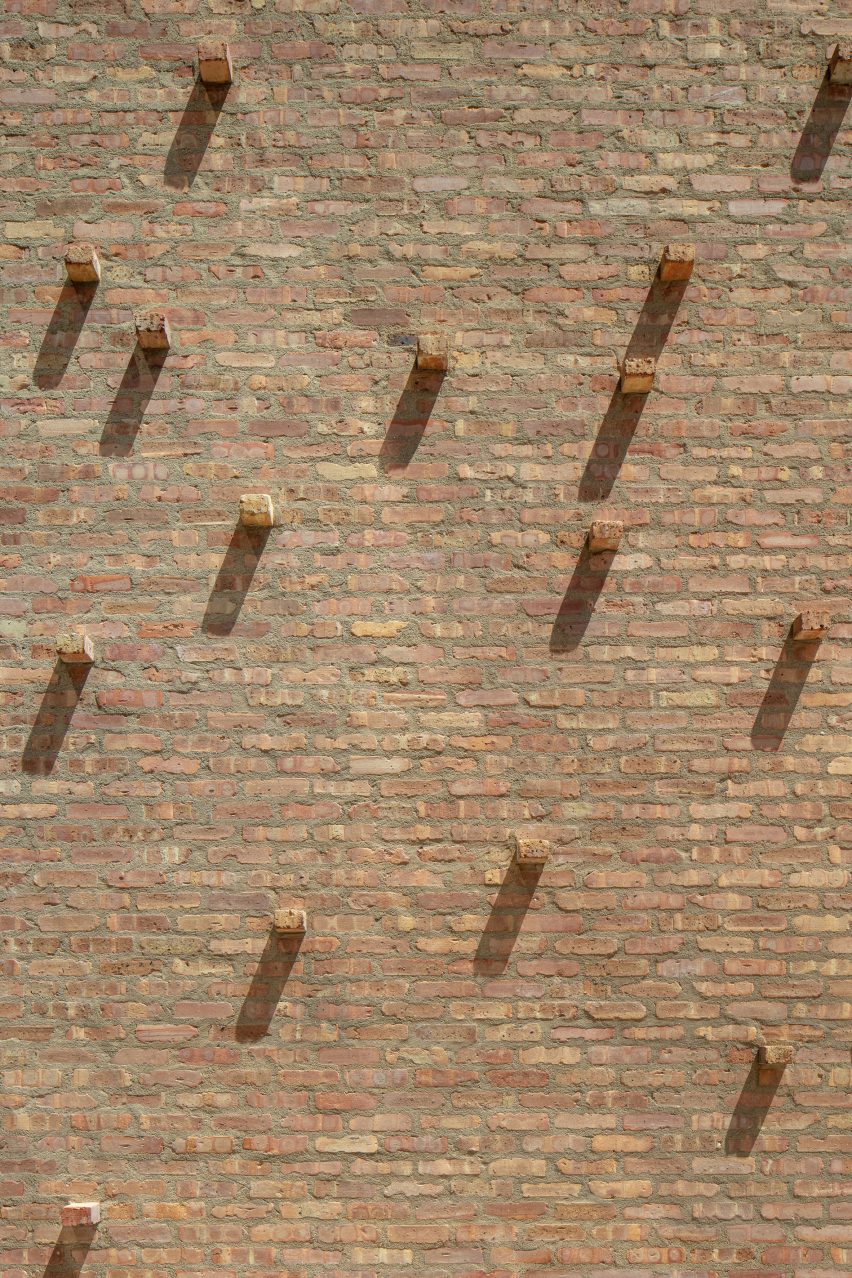 Extruded bricks in a brick wall