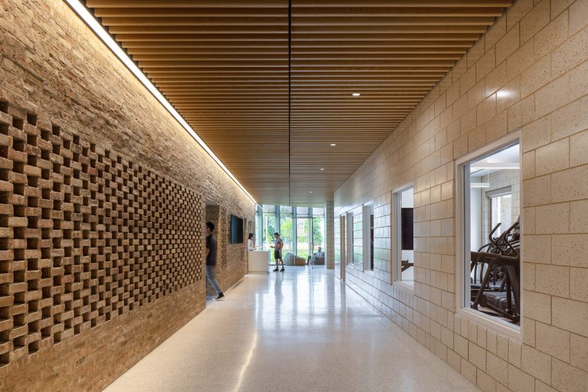 Indoor circulation space with a perforated brick wall
