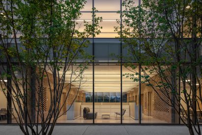 Courtyard looking into a glazed building with office meeting rooms
