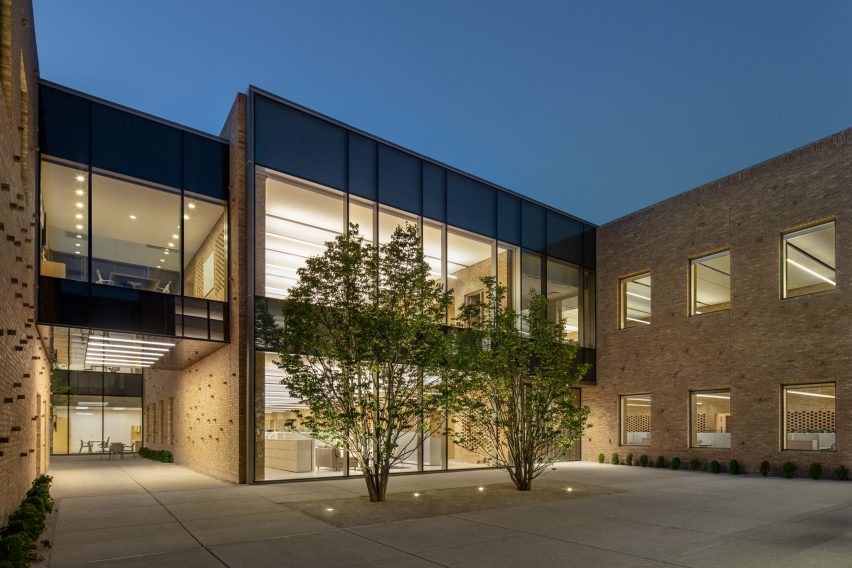 Courtyard surrounded by glass and brick buildings