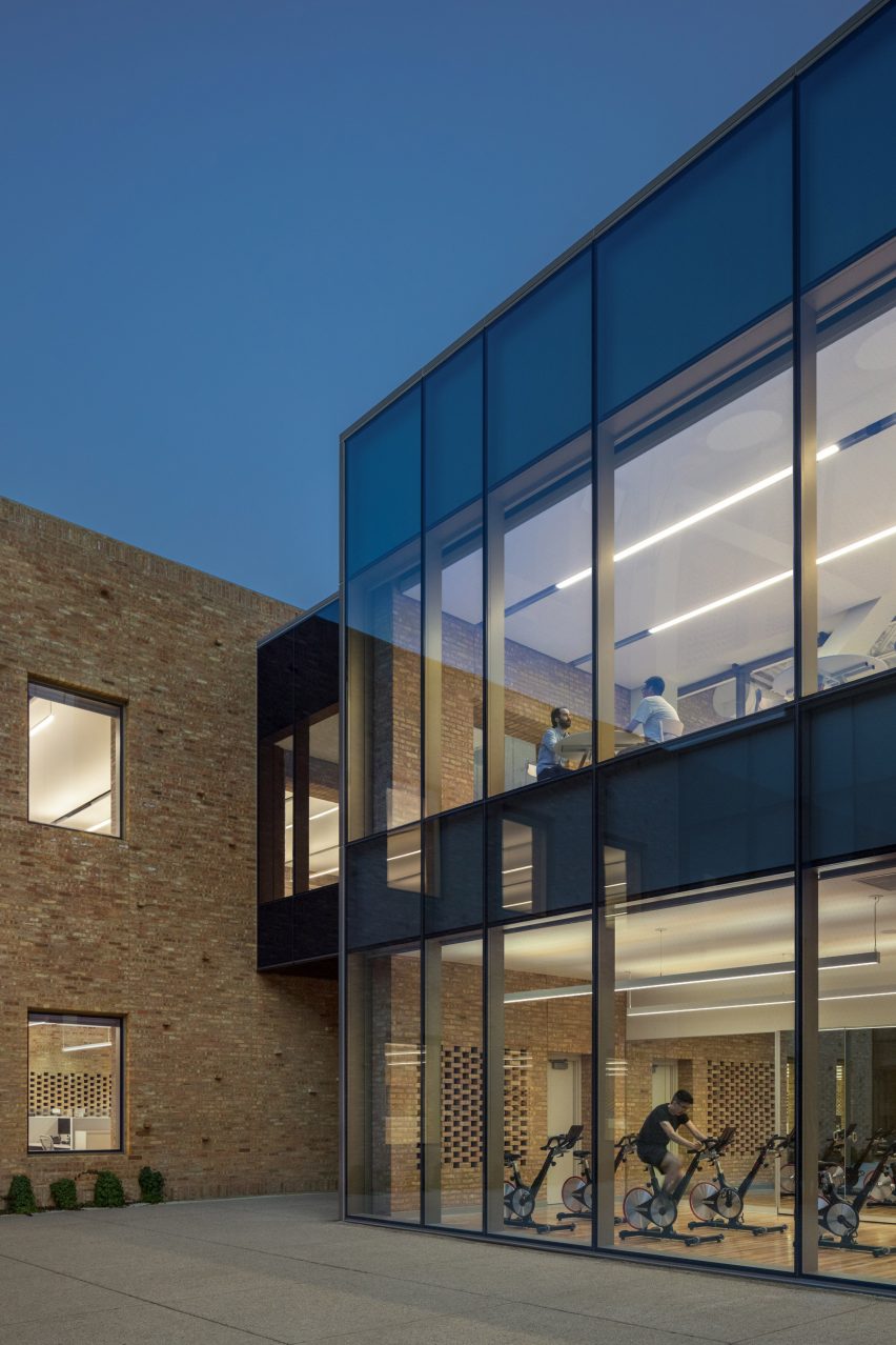 Courtyard surrounded by a brick and glass building