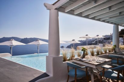 Restaurant overlooking infinity pool and caldera