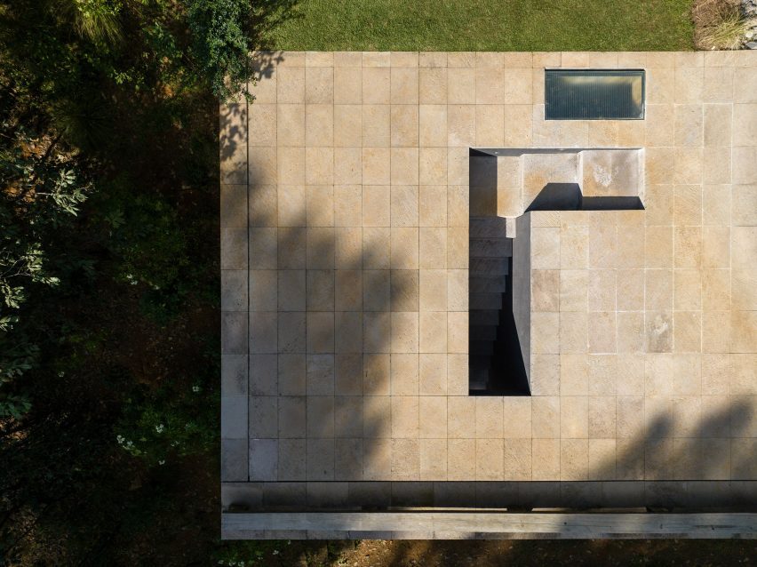 A submerged staircase in a stone terrace