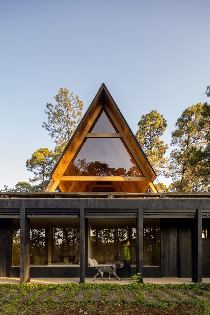 An A-frame paviion placed on top of a rectangular building