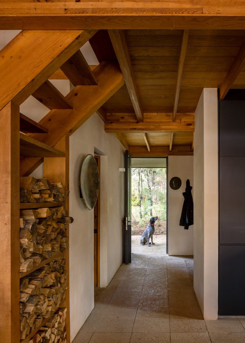 A hallway with a dog at the end