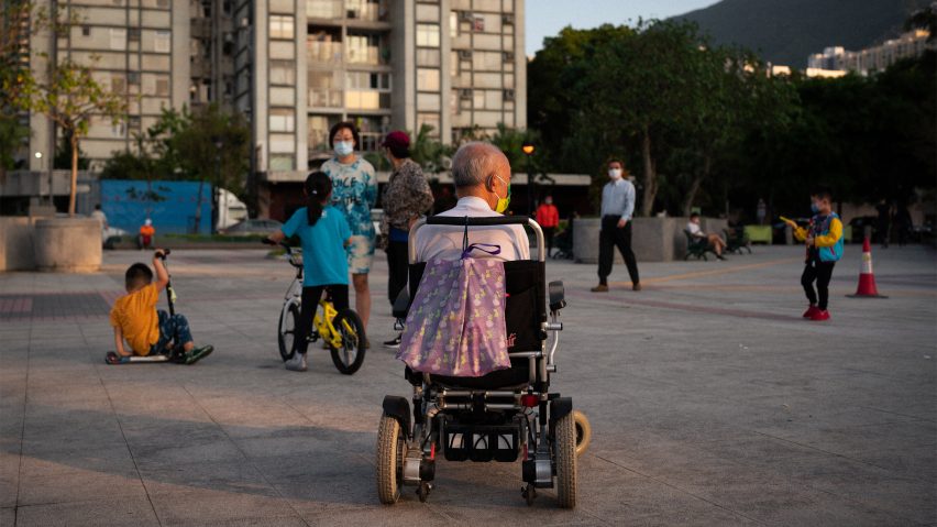 Man in wheelchair and kids playing