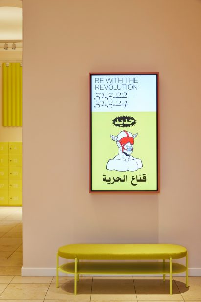Bench and digital display in foyer of MK&G museum