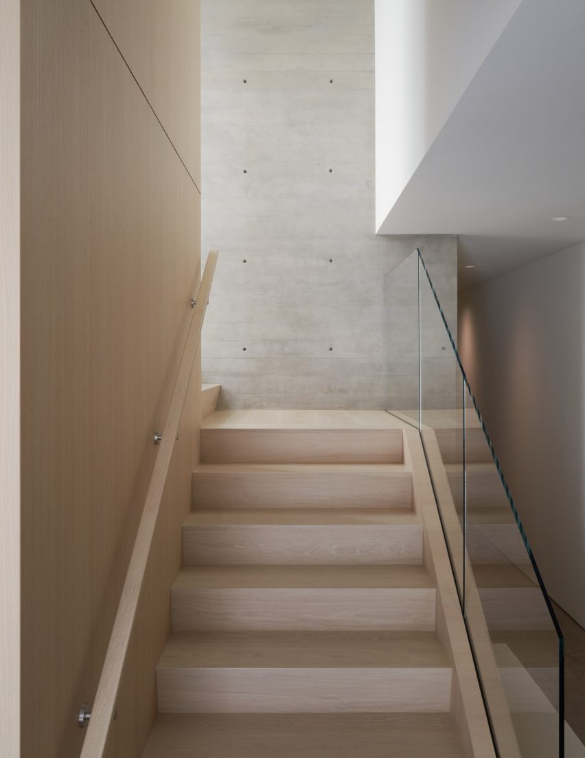 Timber staircase with a glass balustrade