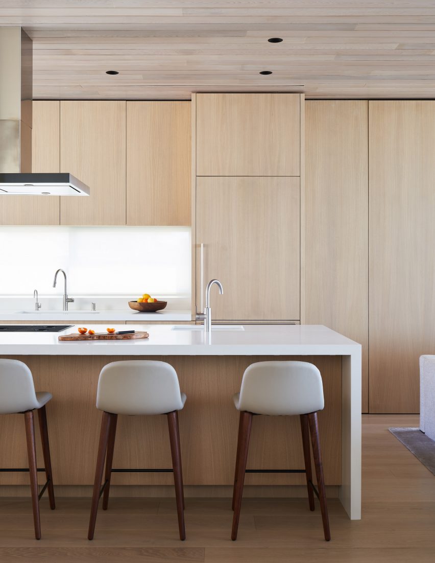 Kitchen with timber cabinets and a white island