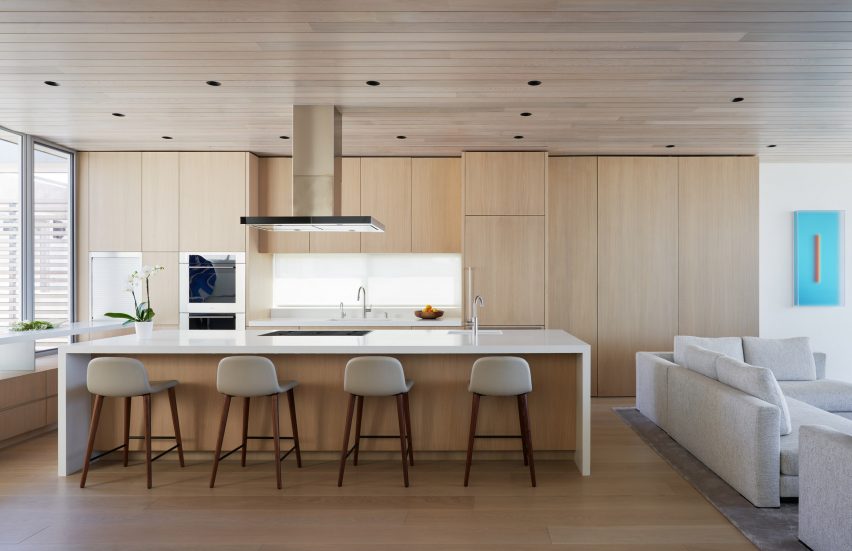 Kitchen with timber cabinets and white kitchen island