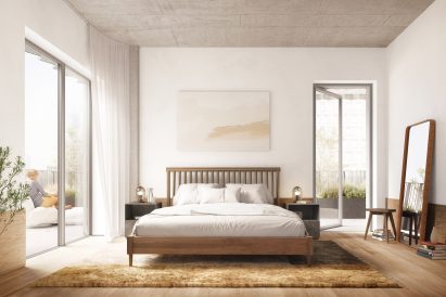 A large bedroom with entrances to an outdoor terrace on either side