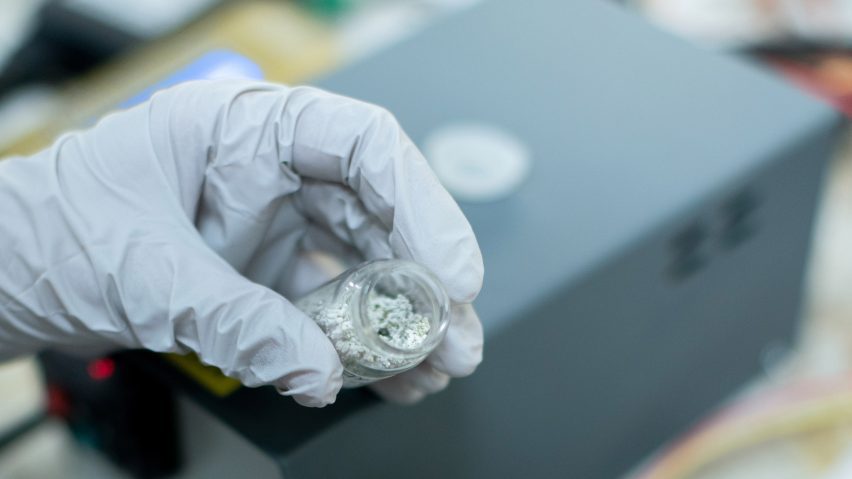 Scientist holding material
